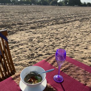 Mohinga soup and champagne in a peanut field in Myanmar, the ultimate elegant food in a rustic setting…