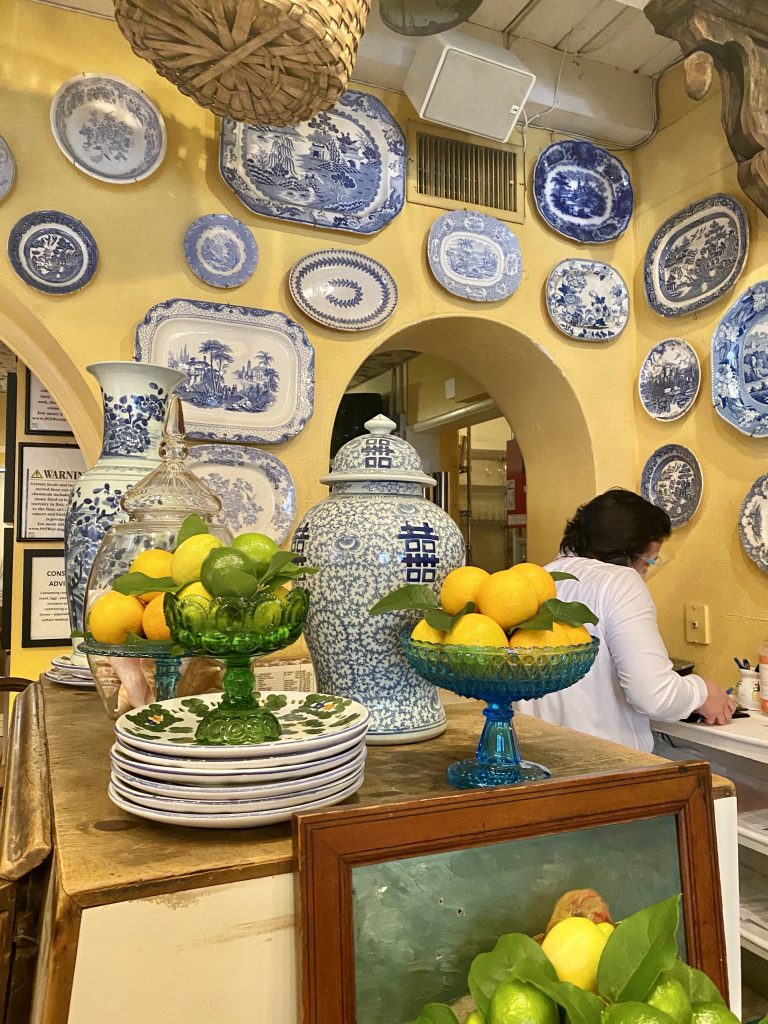 Blue and white china on yellow fresh lemon display