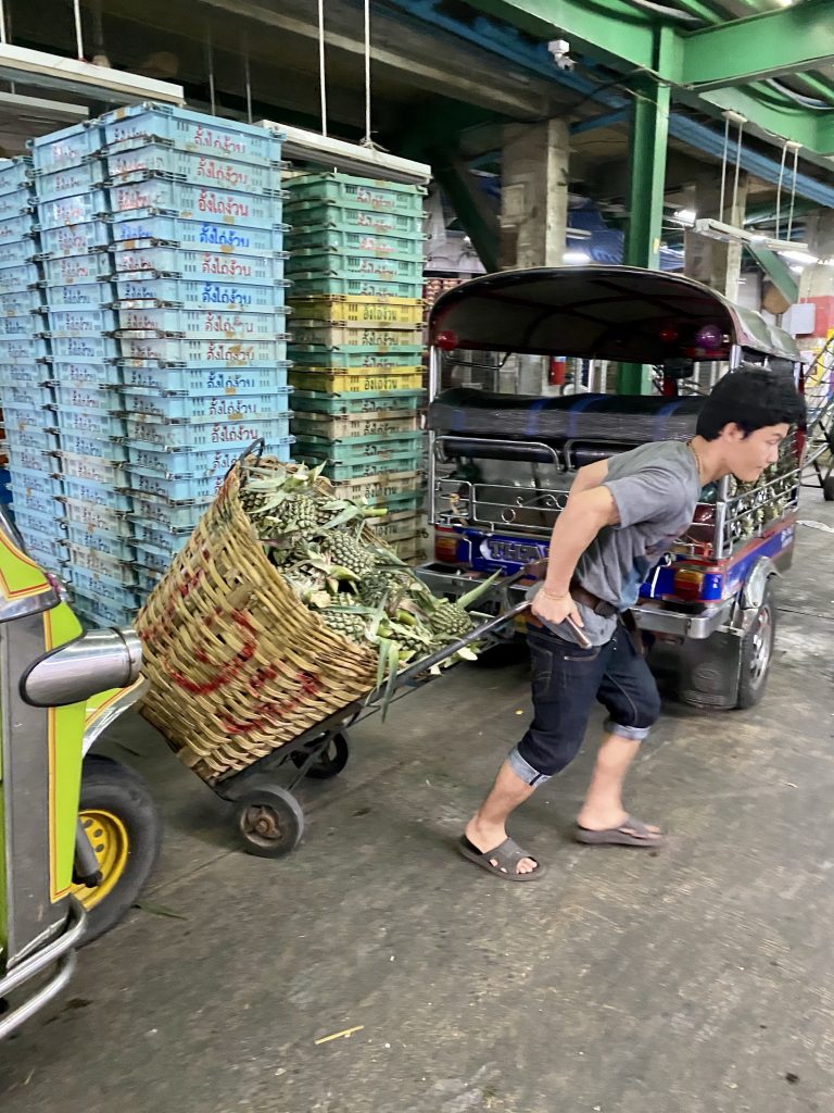 Fresh cut pineapples, baskets of pineapples, Bangkok produce market, Pak Khlong Talat
