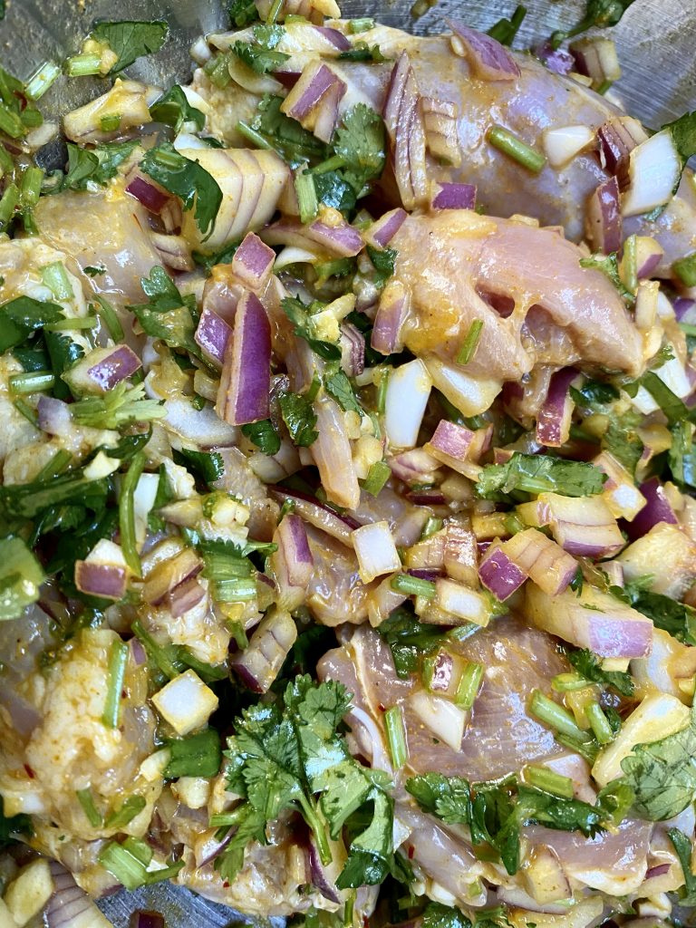 cilantro, bunch of cilantro, chopped cilantro, red onions, olive oil, spices, marinade, chicken thighs, boneless skinless chicken thighs