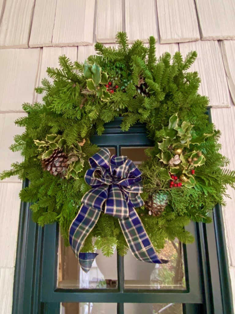 Holiday wreath with custom bow, blue and green plaid ribbon bow, holiday wreath on green door, custom bow how to, diy bows made with ribbon, deluxe bows diy