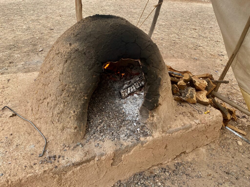 wood burning stove, M'semen, flatbread, Moroccan flatbread, Agafy Desert, Morocco, Bedouin tent, Nomadic, Nomad life, Scarabo Camp