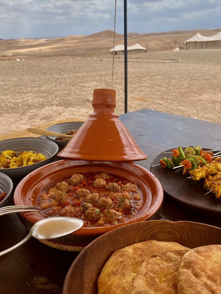 lunch in the dessert, chicken kababs, kafta, batbout, tagine, Scarabeo Camp, elegant food in a rustic setting , Agafy desert, Morocco, tent dining, nomadic life, luxury tent living, indoor outdoor living, indoor outdoor dining