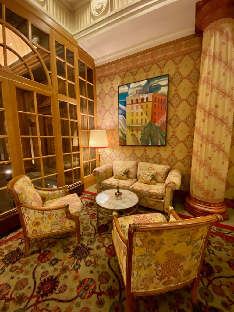 Hotel Kulm, St. Moritz, gold and ruby wallpaper, gold and ruby upholstery