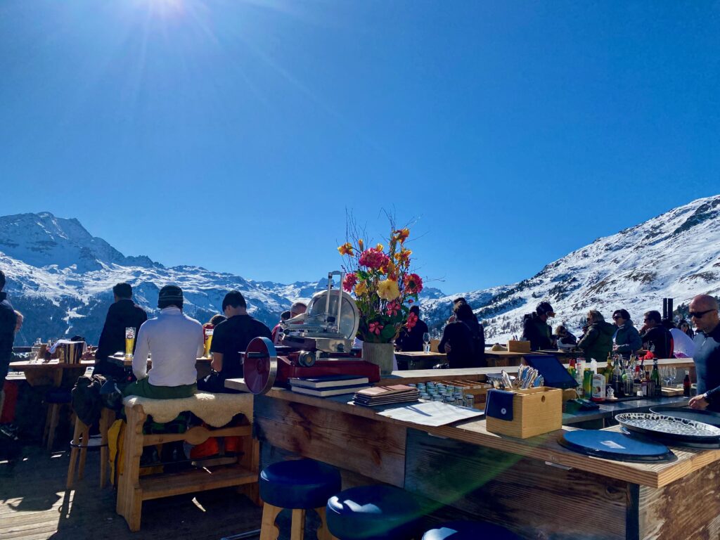 Paradiso club, Saint Moritz, après ski, shearling seat covers, The alps, elegant food in a rustic setting, alfresco dining, indoor outdoor living