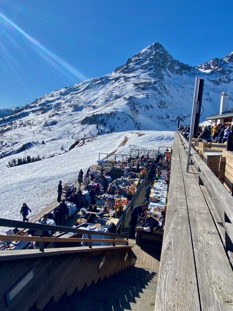 Paradiso club, Saint Moritz, après ski, shearling seat covers, The alps, elegant food in a rustic setting, alfresco dining, indoor outdoor living