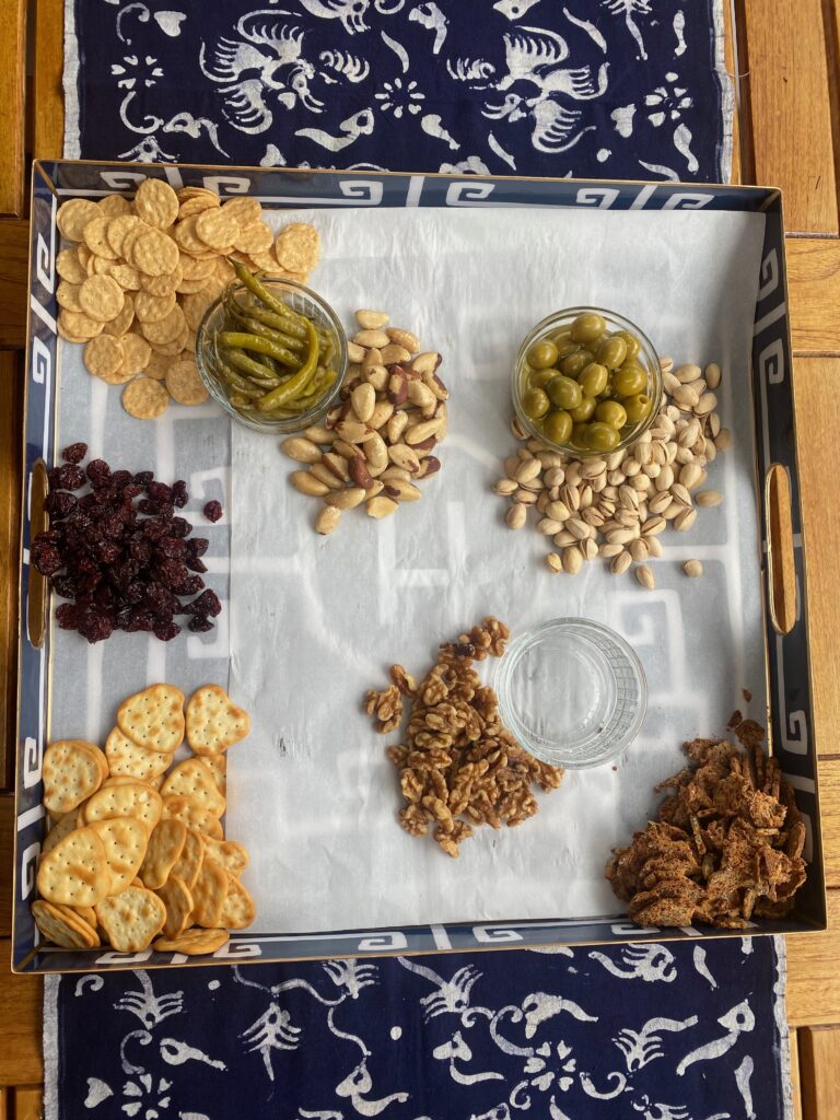 Splendid Party platter, crackers, pistachio nuts, dried sour cherries, blue and white tray, pickled peppers, olives, splendid fêtes, splendid food