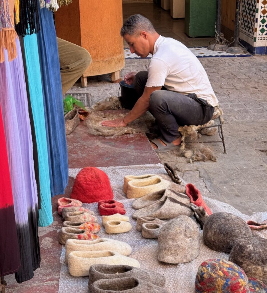 Souk, Marrakech, Medina, man making felted wool products